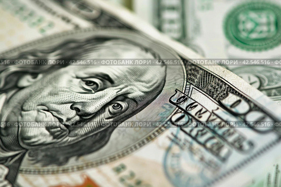 Close up of one hundred dollar bill with focus on Benjamin Franklins face. Стоковое AI-изображение, AI-художник Юрий Поздников / Фотобанк Лори