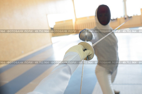 close up of woman during fencing training. Стоковое фото, агентство Ingram Publishing / Фотобанк Лори