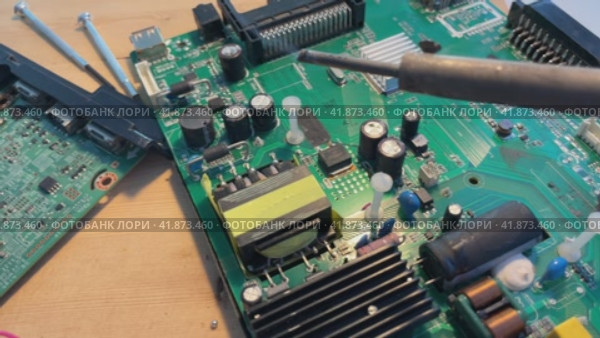 Close up Soldering a micro chip processor with iron tool on a green circuit boad. Electroncs service technology and macro computer concept background. Стоковое видео, видеограф Ирина Старикова / Фотобанк Лори