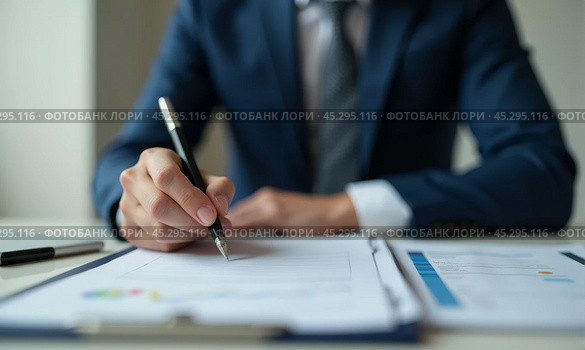 Close-up view business executive blue suit reviewing signing important document, focus on hand pen ready to write, concept of agreement finalization, legal paperwork completion in corporate setting. Стоковое AI-изображение, AI-художник Павел Муравьев / Фотобанк Лори