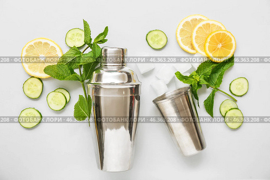 Cocktail shaker and jigger with mojito ingredients on light background. Стоковое фото, фотограф Pixel_shot / Фотобанк Лори