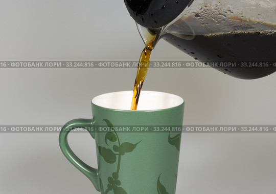 Coffey Pouring in to Cup. Стоковое фото, фотограф Niklas Emmoth / PantherMedia / Фотобанк Лори