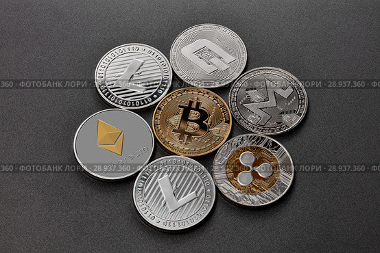 Coins of crypto currency are presented on a dark background. Virtual money concept. Стоковое фото, фотограф Ярослав Данильченко / Фотобанк Лори