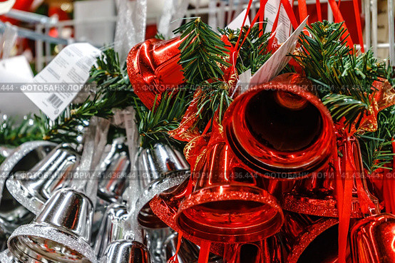 Colorful Christmas bells are hanging in a row. Стоковое фото, фотограф Галина Царькова / Фотобанк Лори