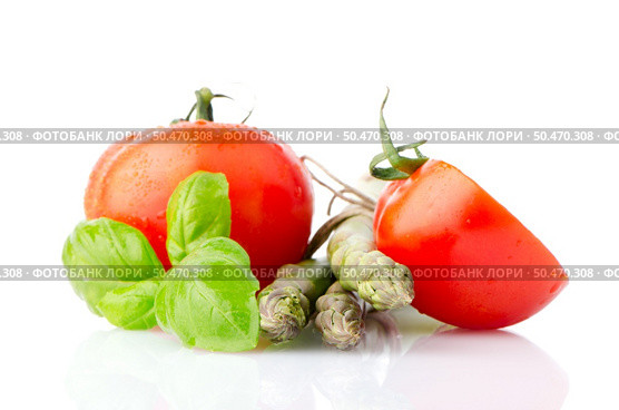 Composition of: tomato and asparagus Isolated on white background. Стоковое фото, агентство Ingram Publishing / Фотобанк Лори