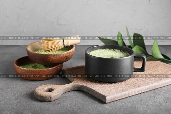 Composition with cup of matcha tea and powder on dark background. Стоковое фото, фотограф Pixel_shot / Фотобанк Лори