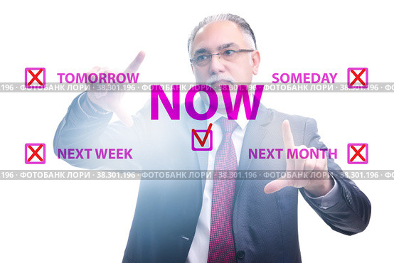 Concept of procrastination with now or later. Стоковое фото, фотограф Elnur / Фотобанк Лори