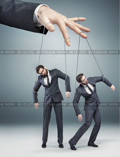 Conceptual picture of controlled employees. Стоковое фото, агентство Ingram Publishing / Фотобанк Лори