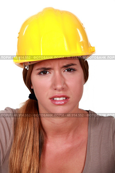 Concerned woman in a hardhat. Стоковое фото, агентство Ingram Publishing / Фотобанк Лори