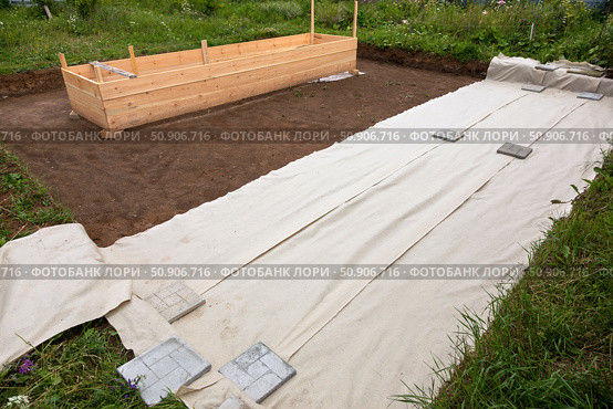 Construction site of a new house with a concrete floor and a wooden frame. Стоковое фото, фотограф Nobilior / Фотобанк Лори