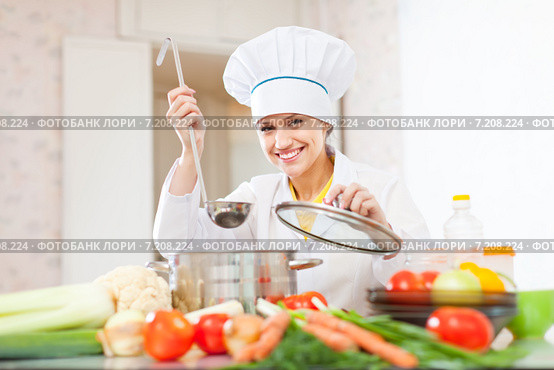 cook works with ladle at kitchen. Стоковое фото, фотограф Яков Филимонов / Фотобанк Лори
