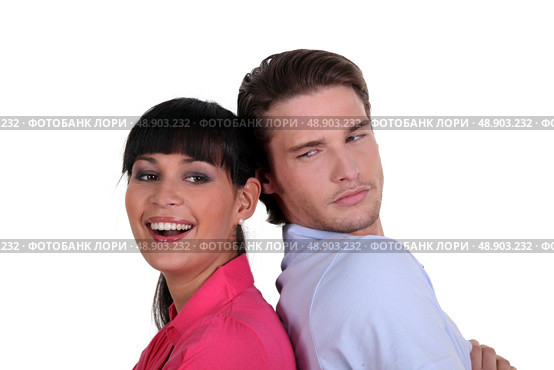 Couple stood back to back. Стоковое фото, агентство Ingram Publishing / Фотобанк Лори