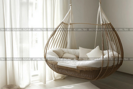 Cozy hanging nest in a bright room with soft textiles and natural light. Уютное подвесное гнездышко в светлой комнате с мягким текстилем и естественным освещением. Стоковое AI-изображение, AI-художник Katsiaryna Repich / Фотобанк Лори
