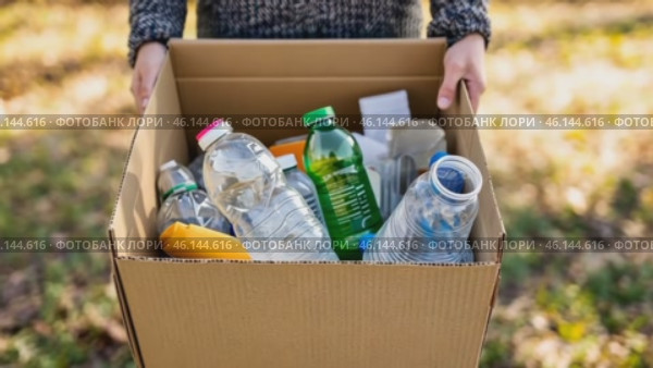 Cropped unrecognized person carrying crate of empty plastic bottles. Recycling plastic concept. Hands with Recycle Bin. Littering of environment. Problem of global plastics pollution of the Earth. Стоковое AI-видео, аниматор Марина Демидюк / Фотобанк Лори