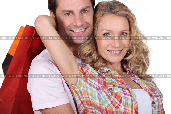 Cuddle with shopping bags. Стоковое фото, агентство Ingram Publishing / Фотобанк Лори