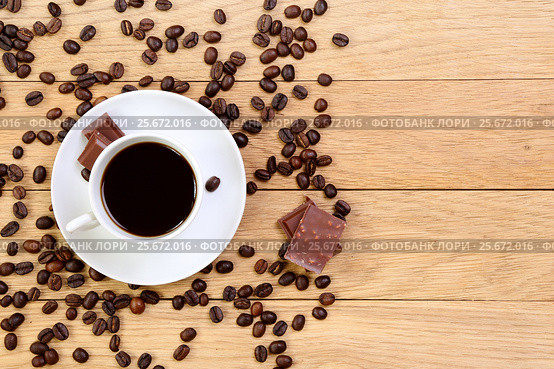 Cup of black coffee, chocolate and coffee beans on a wooden background. Стоковое фото, фотограф Феликс Хромых / Фотобанк Лори