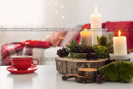 cup of tea with burning candles on white table. Стоковое фото, фотограф Майя Крученкова / Фотобанк Лори