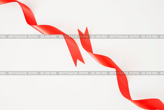 curled red ribbons white background. Стоковое фото, агентство Ingram Publishing / Фотобанк Лори