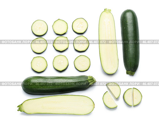 Cut zucchini squashes on white background. Стоковое фото, фотограф Pixel_shot / Фотобанк Лори