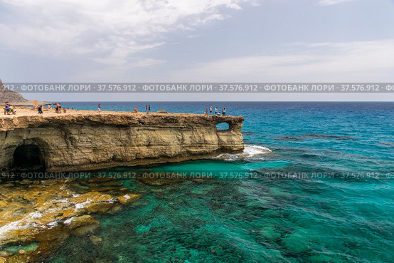 CYPRUS, AYIA NAPA - MAY 11/2018: Tourists visited one of the most popular sights - Sea Caves. Редакционное фото, фотограф Сергей Ляшенко / Фотобанк Лори