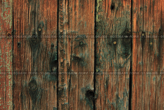 Dark old wooden surface made of separate wooden boards with the remains of paint. Can be used as background with natural texture. Стоковое фото, фотограф Максимова Марина / Фотобанк Лори
