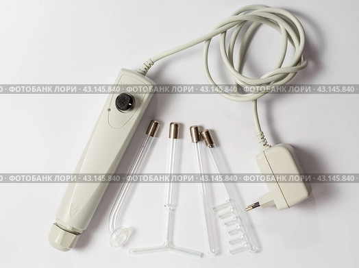 Darsonval on a white background, taking care of yourself at home . medical device for the treatment of acne, cellulite, hair at home and in Spa centers. flat lay. Стоковое фото, фотограф Дмитрий Львович Алферов / Фотобанк Лори