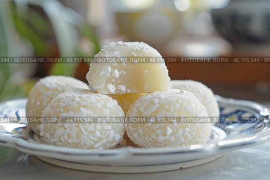 Delicious brazilian beijinho coconut candy balls resting on elegant plate. Стоковое AI-изображение, AI-художник Иван Рябоконь / Фотобанк Лори
