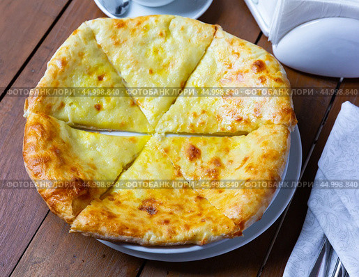 Delicious dish khachapuri Iveria with suluguni cheese. Стоковое фото, фотограф Яков Филимонов / Фотобанк Лори