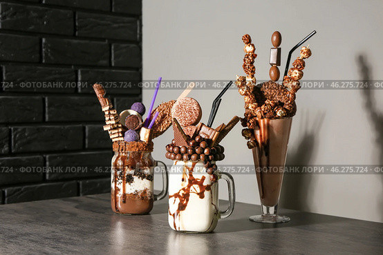 Delicious freak shakes on table. Стоковое фото, фотограф Pixel_shot / Фотобанк Лори