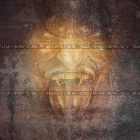 Demon face and scary monster concept as a screaming cruel zombie or vampire appearing from the dark shadows as a horror and halloween concept. Стоковое фото, агентство Ingram Publishing / Фотобанк Лори