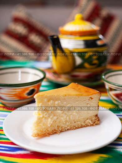 dessert cheesecake in oriental style with a teapot and a cup for tea. Стоковое фото, фотограф Abakumova Ekaterina / Фотобанк Лори