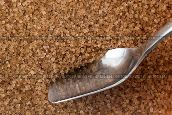 Detail of Browm sugar and spoon from sugar cane - useful as a background. Стоковое фото, агентство Ingram Publishing / Фотобанк Лори