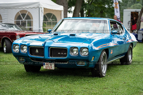 DIEDERSDORF, GERMANY - AUGUST 30, 2020: The muscle car Pontiac GTO, 1970. The exhibition of "US Car Classics". Редакционное фото, фотограф Sergey Kohl / Фотобанк Лори
