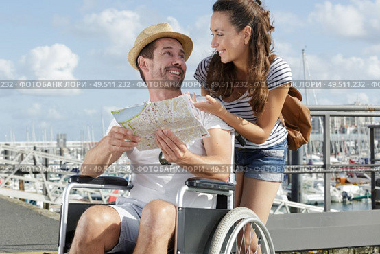 disability man talking to wife about where to go. Стоковое фото, агентство Ingram Publishing / Фотобанк Лори