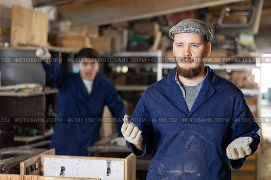 Disgruntled furniture factory owner yells at careless worker. Стоковое фото, фотограф Яков Филимонов / Фотобанк Лори