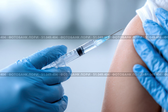 Doctor making a vaccination. Cropped of man receiving vaccine shot. Hands injecting coronavirus vaccine syringe to arm muscle of patient. Covid 19 immunization. Mpox, Dengue fever, Chikungunya. CHIKV. Стоковое AI-изображение, AI-художник Марина Демидюк / Фотобанк Лори
