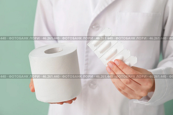 Doctor with toilet paper and hemorrhoidal suppositories, closeup. Стоковое фото, фотограф Pixel_shot / Фотобанк Лори
