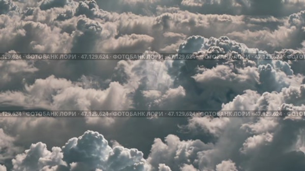 Dramatic Cloudscape, fluffy white and grey clouds, weather background. Стоковое AI-видео, аниматор KATERINA AI / Фотобанк Лори