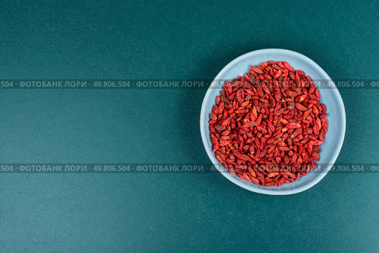 Dried Goji Berries in Bowl, Healthy Food, Superfood. Space for text.. Goji berry, strengthening the immune system. Стоковое фото, агентство Ingram Publishing / Фотобанк Лори