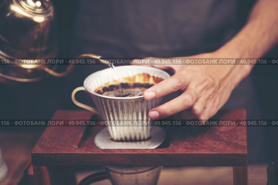 Drip brewing, filtered coffee, or pour-over is a method which involves pouring water over roasted, ground coffee beans contained in a filter. Стоковое фото, агентство Ingram Publishing / Фотобанк Лори