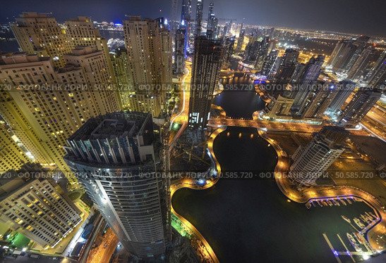Dubai marina skyscrapers during night hours. Стоковое фото, агентство Ingram Publishing / Фотобанк Лори