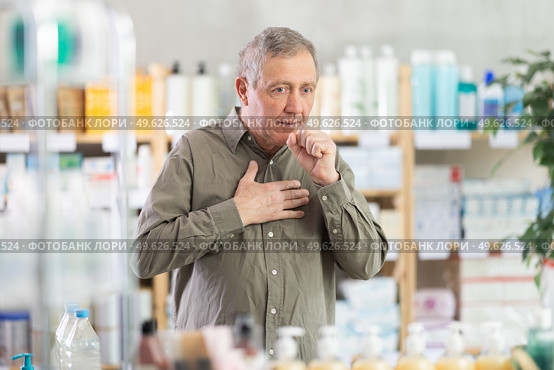 Elderly man with cough in pharmacy. Стоковое фото, фотограф Яков Филимонов / Фотобанк Лори