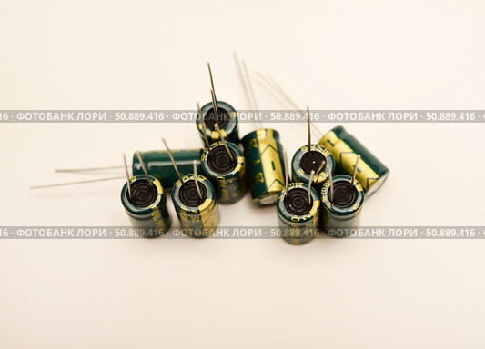 Electrolytic capacitors of different nominal values. Energy storage devices. Electronic radio elements. Стоковое фото, фотограф Valeriy Lushchikov / Фотобанк Лори