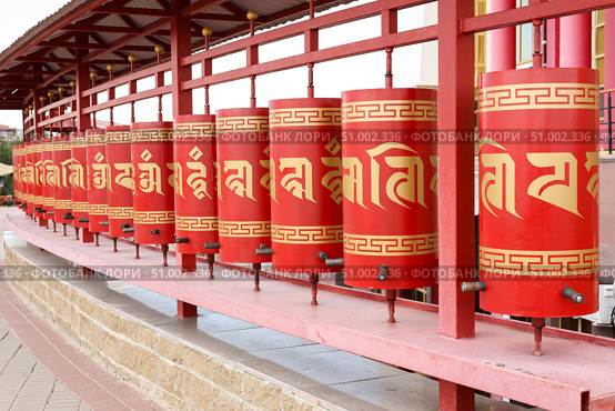 Elista, capital of Republic of Kalmykia, Russia, July, 4, 2025: Prayer drums of khurul, Buddhist temple Golden Abode of Buddha Shakyamuni, largest Buddhist temple in Europe. Редакционное фото, фотограф Екатерина Топорова / Фотобанк Лори