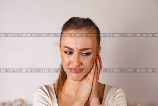Emotions Captured in a Moment of Reflection and Vulnerability From a Young Woman in a Studio Setting. Стоковое фото, фотограф Aleksandr Golubev / Фотобанк Лори