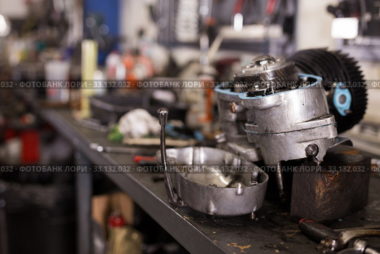 Empty workshop for motorbike repair with table with different tools. Стоковое фото, фотограф Яков Филимонов / Фотобанк Лори