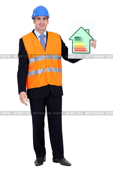 Engineer holding up efficiency chart. Стоковое фото, агентство Ingram Publishing / Фотобанк Лори