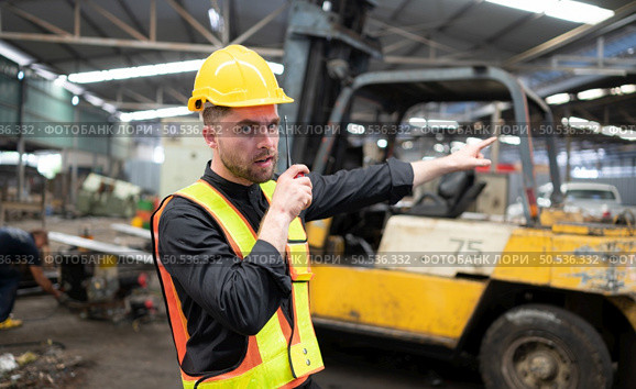 Engineers must utilize walkie talkie to move heavy equipment quickly and without becoming stranded. Стоковое фото, агентство Ingram Publishing / Фотобанк Лори