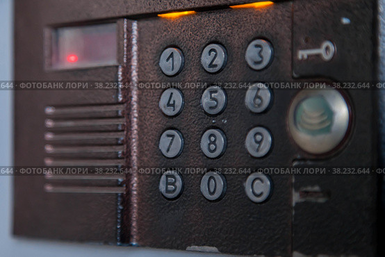 Entry intercom to block in an apartment residential building. Panel of doorbells in large buildings. Background for your creative with an inscription or logo. Copy space. Стоковое фото, фотограф Aleksandr Golubev / Фотобанк Лори