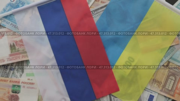 euro, dollar, rubles banknotes lying on black Ukraine russia usa flag, concept. Стоковое видео, видеограф Olesia Kondrateva / Фотобанк Лори